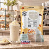 Base Big Train 20 Below White Chocolate Chocolate Blanco Bolsa 1590 Gramos en escena con letrero central Kitchen Experts