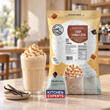 Base Big Train Vainilla Bean 1.59 kg con bebida preparada y letrero Kitchen Experts integrado en la escena