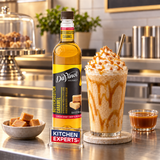 Escena promocional JARABE DAVINCI BUTTERSCOTCH BOTELLA 750 MILILITROS con letrero KEX