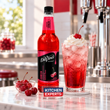 Escena promocional Jarabe DaVinci Cereza Botella 1 Litro con letrero KEX