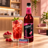 Jarabe DaVinci Frambuesa Tea Botella 1 Litro en escena con letrero KEX