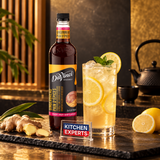 Jarabe DaVinci Jengibre Botella 750 Mililitros en escena con letrero KEX