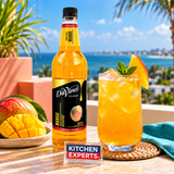 Jarabe DaVinci Mango Botella 1 Litro en escena con letrero KEX