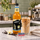 Jarabe DaVinci Vainilla Francesa Sugar Free 1 Litro en escena de cafetería con letrero KEX al centro