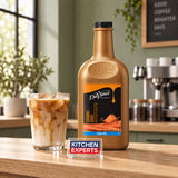 Salsa DaVinci Caramelo Sugar Free Botella 1/2 Galón en escena de cafetería con letrero KEX al centro