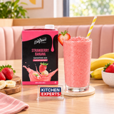 Smoothie Mix DaVinci Gourmet Strawberry Banana 1.42 L en escena de cafetería con letrero KEX al centro